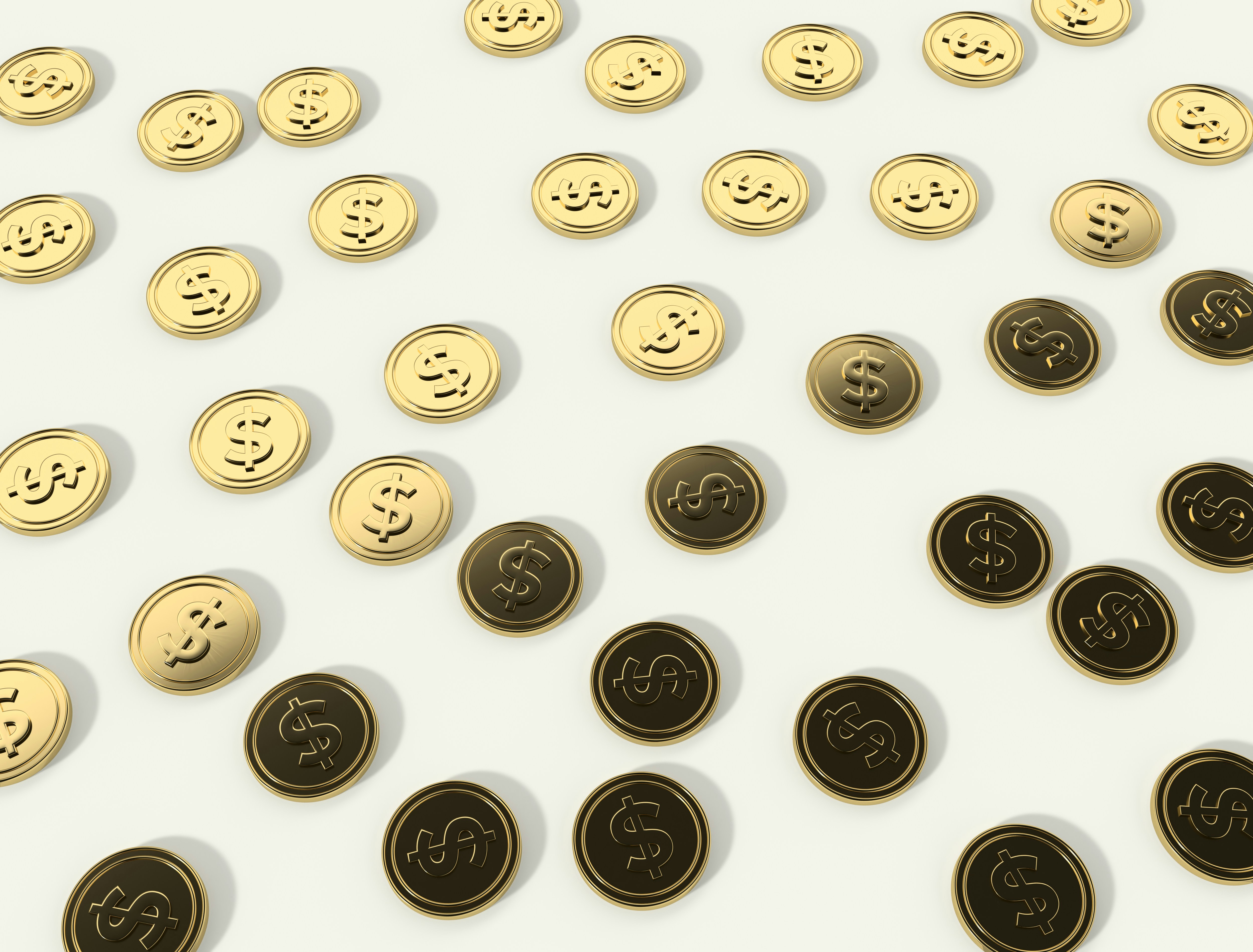A scattered pattern of gold and dark coins with dollar signs embossed on them, set against a light background.